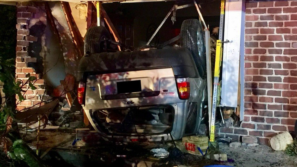 A West Des Moines man remains in critical condition Tuesday after his car crashed into a house