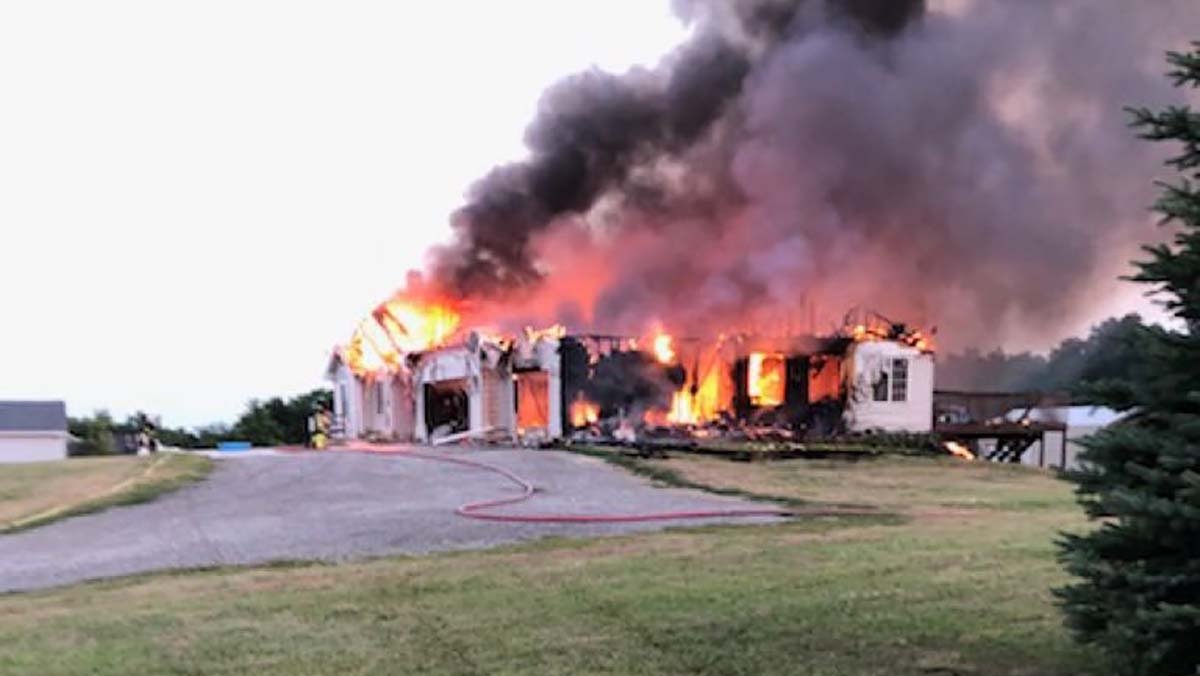 Fire crews were still putting out hot spots Friday morning in a fire that destroyed an Indianola home