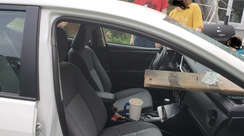 A child riding in the front seat of a car was not hurt after the driver lost control and hit several mail boxes.
